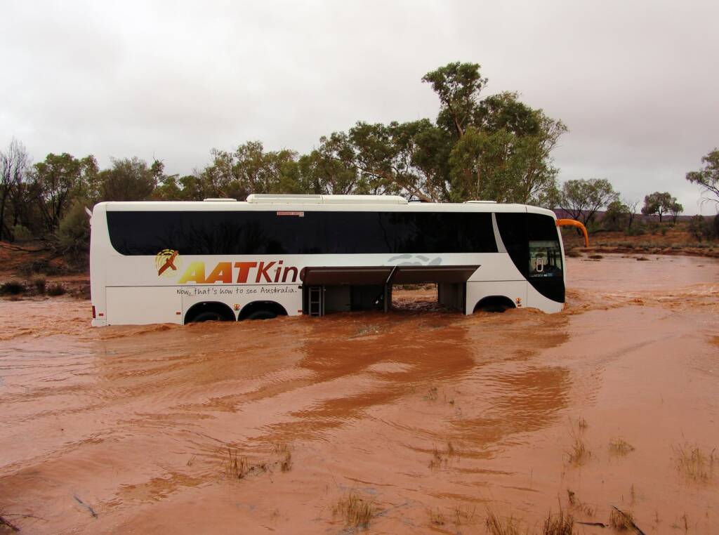 Traversing across the flooded Kings Creek - Watarrka National Park
