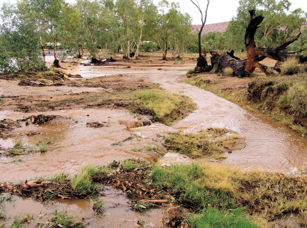 Todd River spilling across Tuncks Road, causing it's temporary closure, 8 Jan 2010