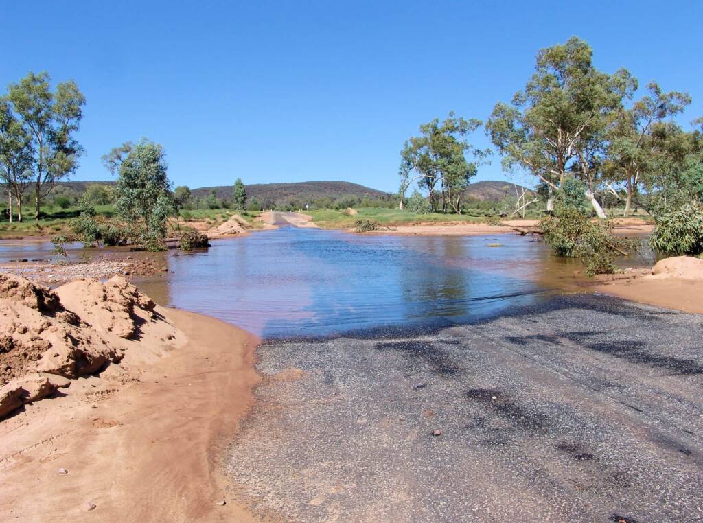 Hugh River flowing across Namatjira Drive, West MacDonnell Ranges