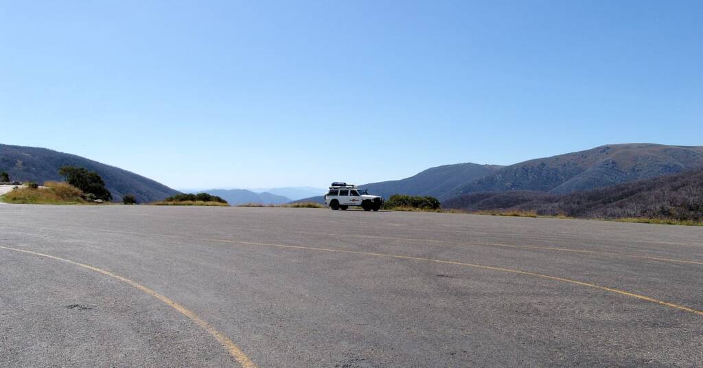 Plenty of parking at Falls Creek, against the spectacular scenic backdrop of the Alpine National Park
