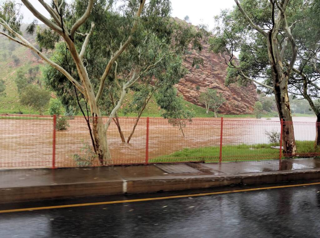 Driving through Heavitree Gap with the Todd River in flow, Alice Springs, NT