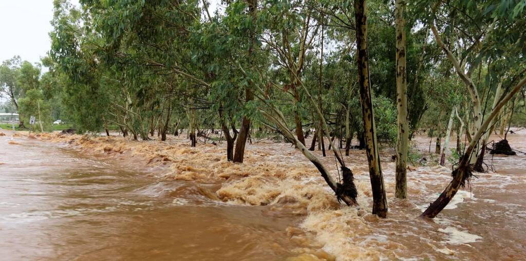 Todd River raging across Palm Circuit, Alice Springs, NT