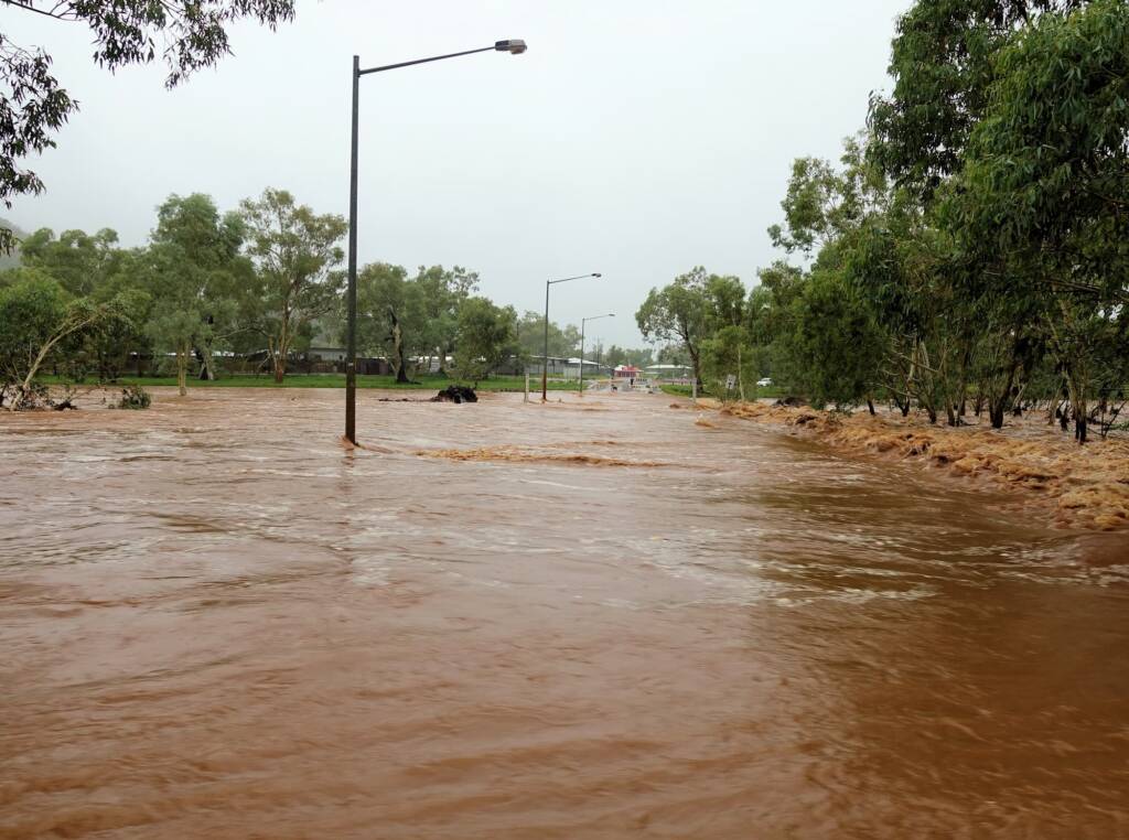 Todd River raging across Palm Circuit, Alice Springs, NT