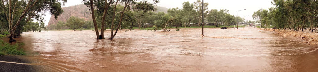 Todd River raging across Palm Circuit, Alice Springs, NT