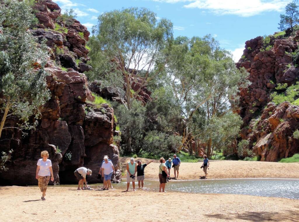 Tourist group enjoying Emily Gap (Emily and Jessie Gaps Nature Park), East MacDonnell Ranges