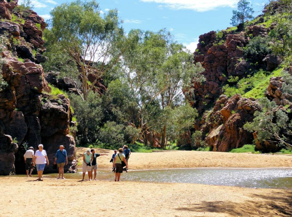 Tourist group enjoying Emily Gap (Emily and Jessie Gaps Nature Park), East MacDonnell Ranges