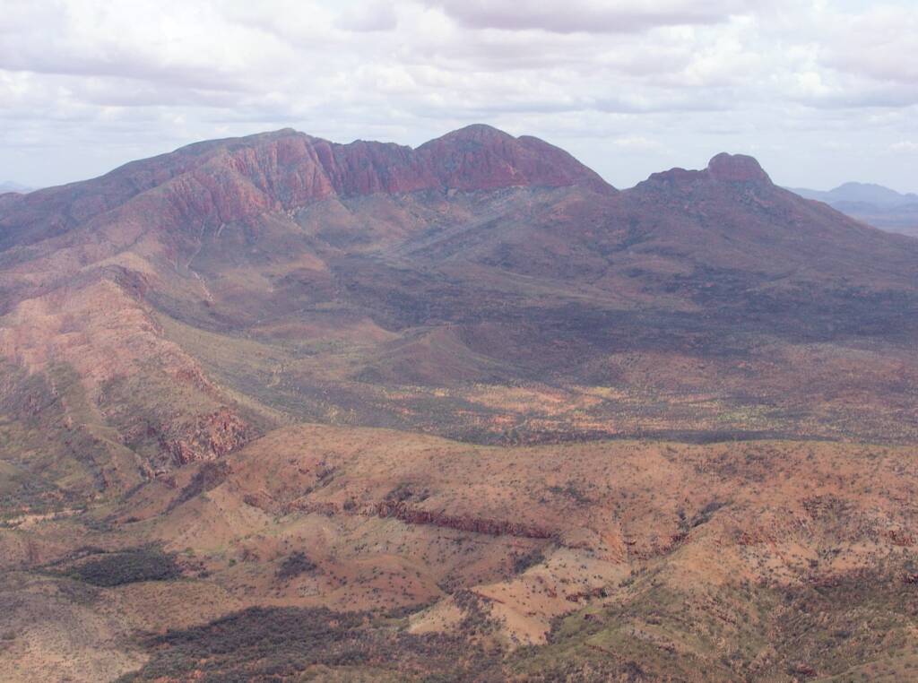 Helicopter ride on a cloudy day over Mount Sonder, West MacDonnell Range