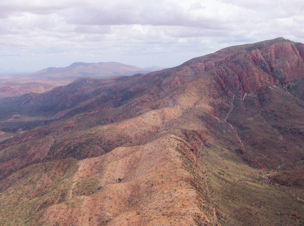 Helicopter ride on a cloudy day over Mount Sonder, West MacDonnell Range