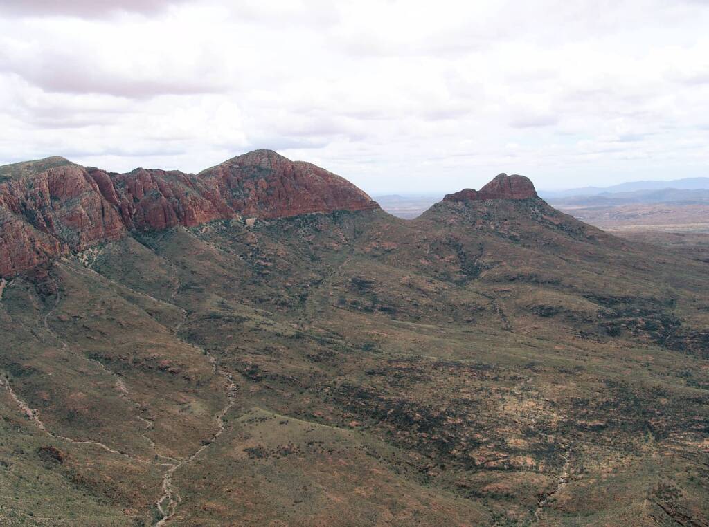 Helicopter ride on a cloudy day over Mount Sonder, West MacDonnell Range