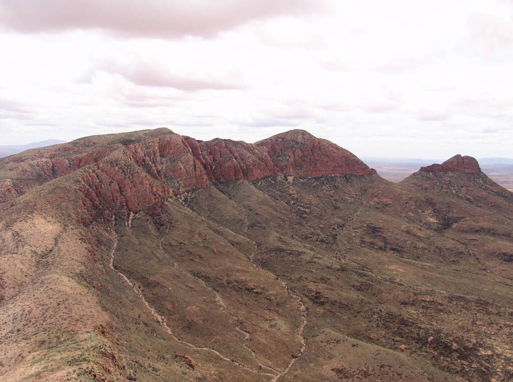 Helicopter ride on a cloudy day over Mount Sonder, West MacDonnell Range