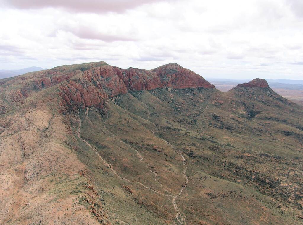 Helicopter ride on a cloudy day over Mount Sonder, West MacDonnell Range