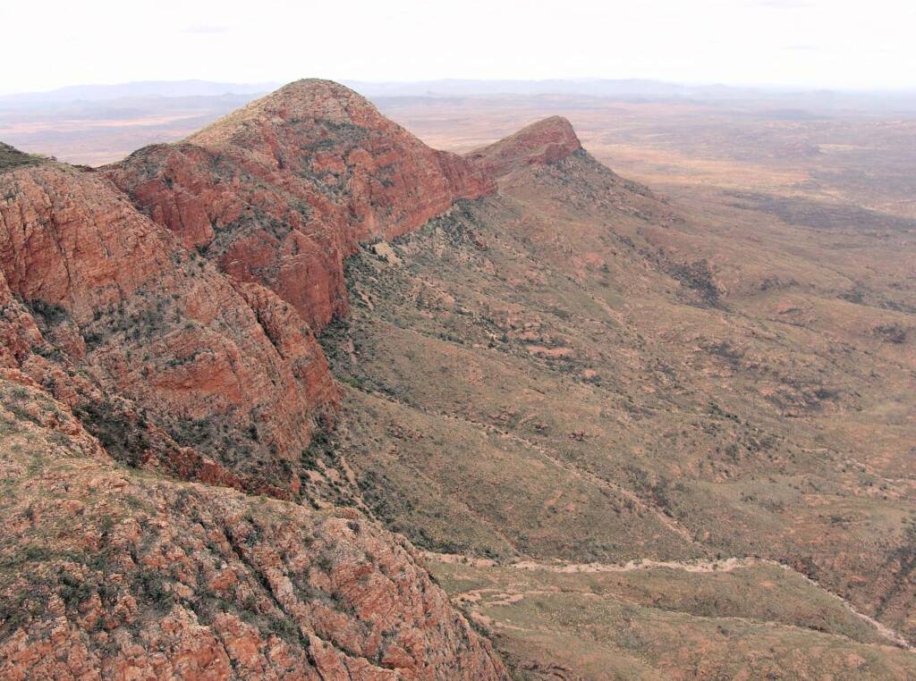 Helicopter ride on a cloudy day over Mount Sonder, West MacDonnell Range