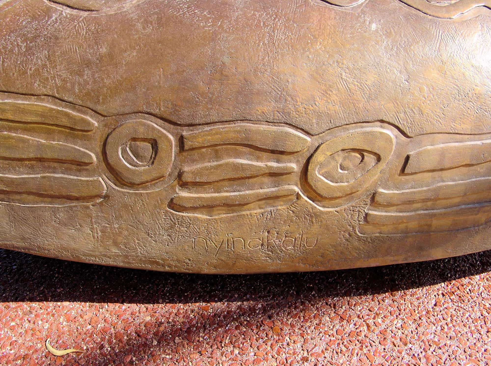 Coolamon - Walpiri language: Nyinakalu - Translation: 'come, sit, be'