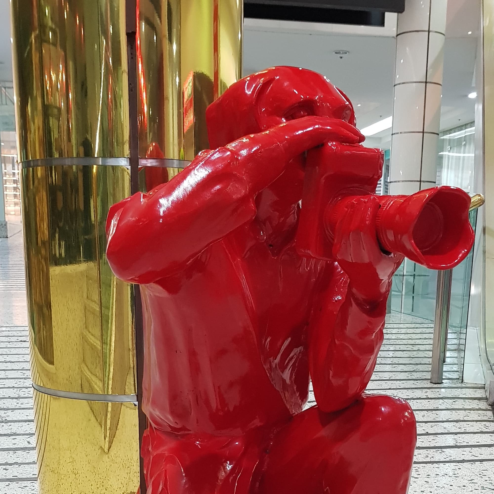 Red Paparazzi Dog (Bronze Sculpture with Red Powdercoat) by Gillie and Marc