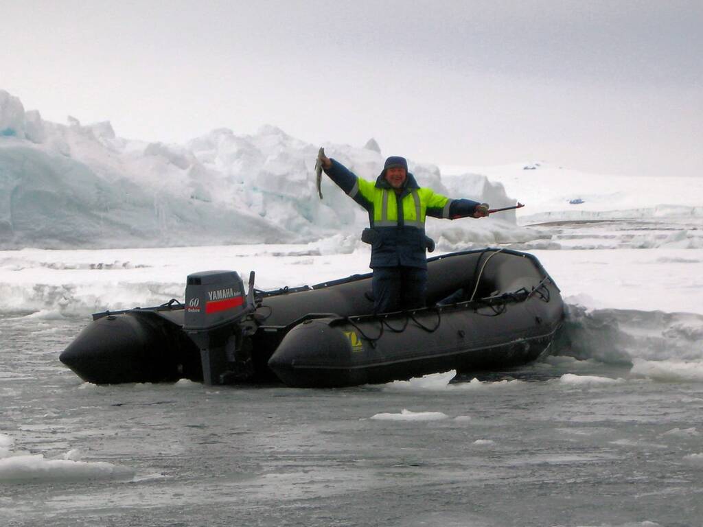 Fellow traveller Vlad doing a spot of fishing, Antarctic © Jennifer Cooke