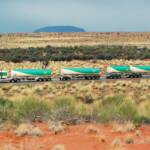 BP Road Train passing Uluru (Ayres Rock), Central Australia © Hans Boessum