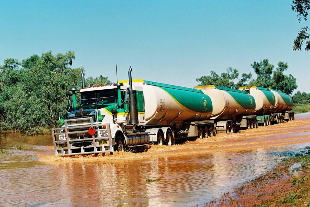 BP Road Train (through flooded river creek), Central Australia © Hans Boessum