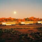 Shell road train passing Karlu Karlu (the Devil Marbles), Central Australia NT © Hans Boessum
