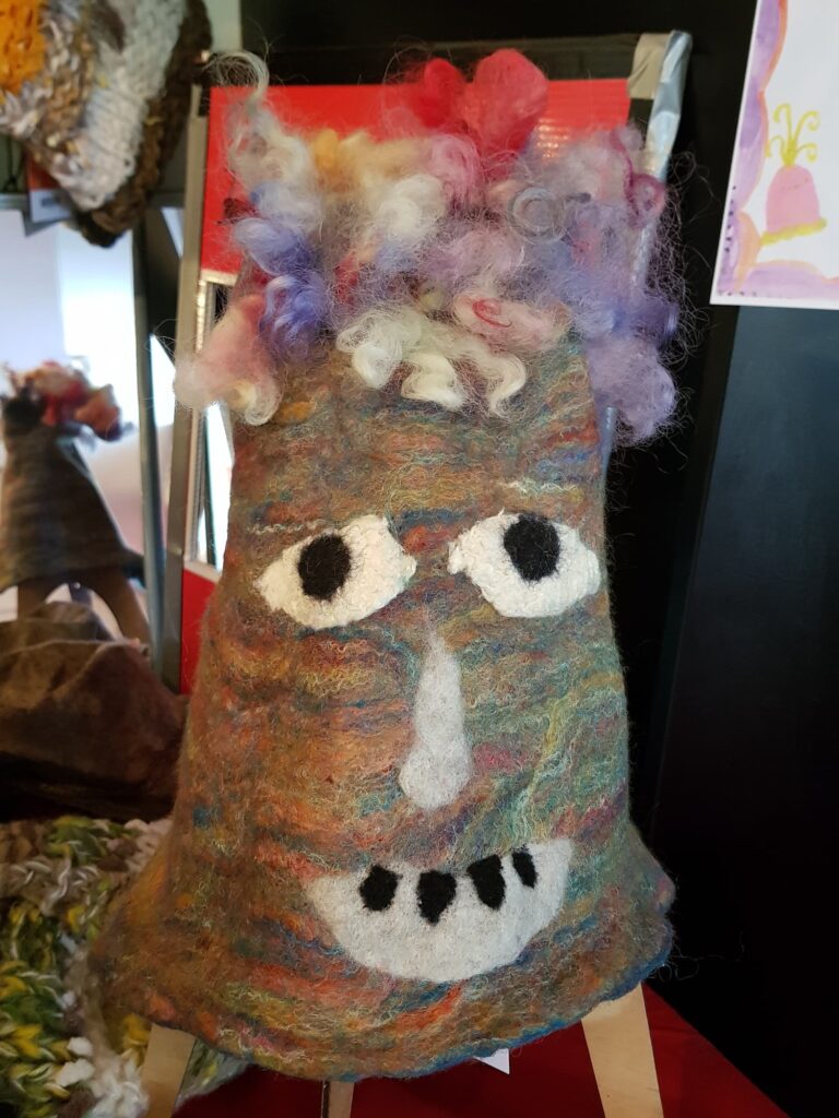 Happy Face by Pat Meehan, Thurgoona NSW, Alice Springs Beanie Festival 2025