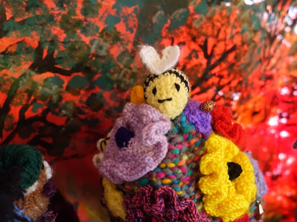 Bees on spring flowers by Loraine Melis, Alice Springs Beanie Festival 2025