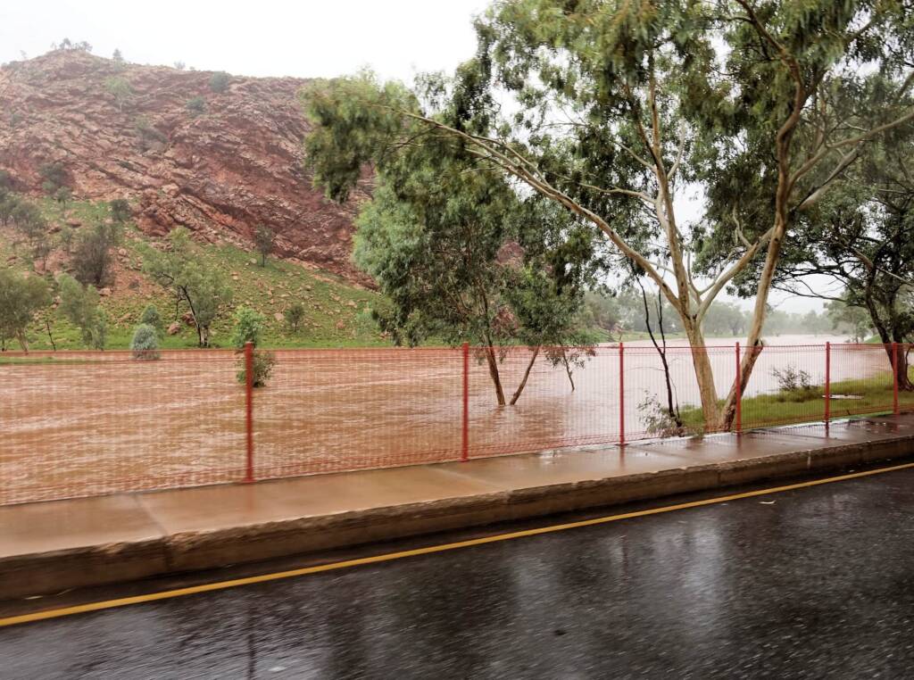 Driving through Heavitree Gap with the Todd River in flow, Alice Springs, NT