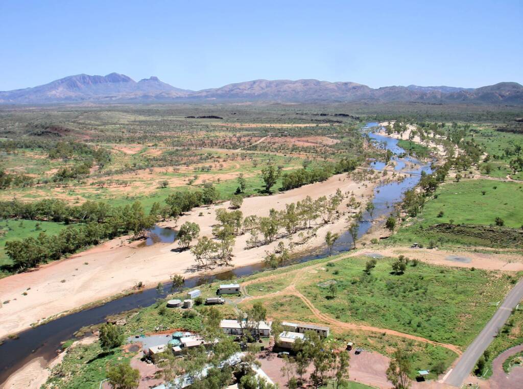 Aerial view of Finke River with Mount Sonder on the horizon and flying above Glen Helen.