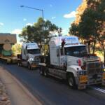 Road train hauling 230 tonne engine for the power station, Central Australia NT © Hans Boessum