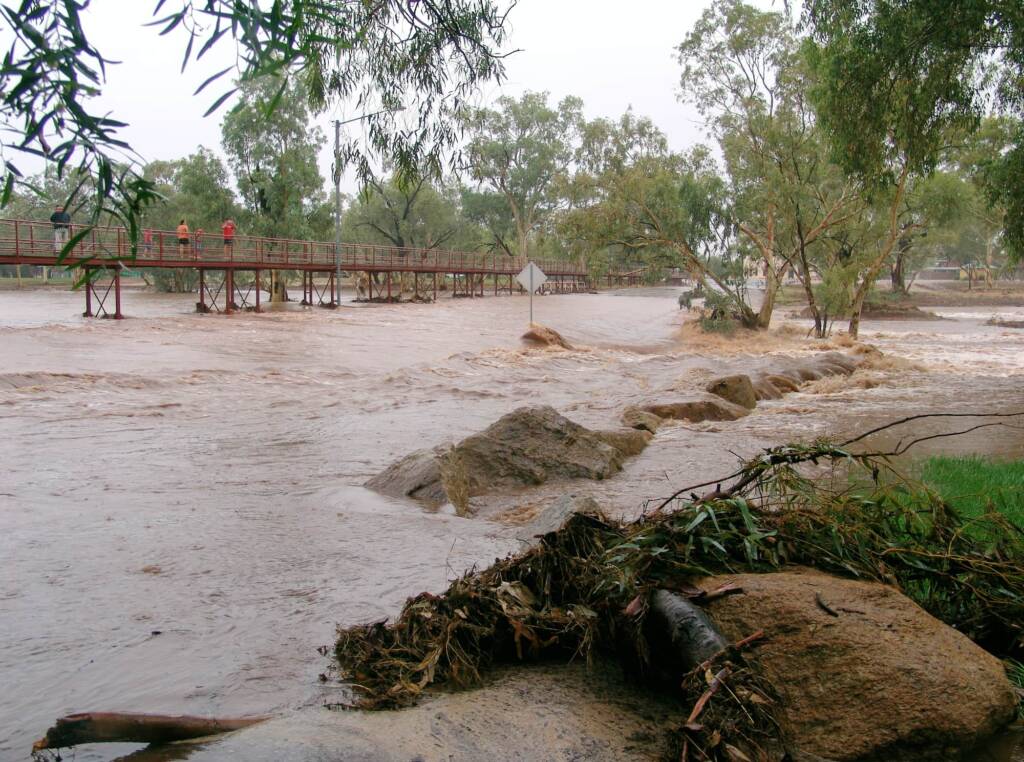 Water flowing over Undoolya Road causeway and under the footbridge, Todd River, Alice Springs, 9 Jan 2010