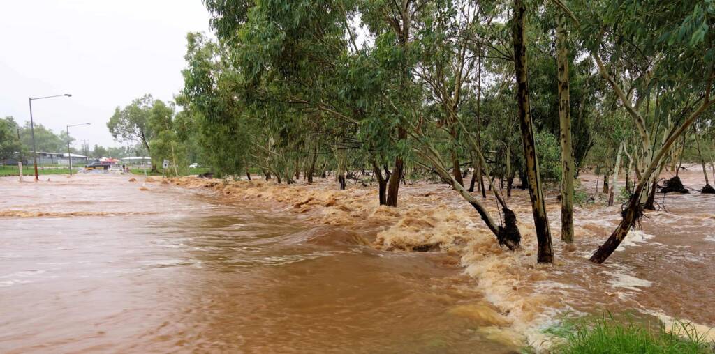Todd River raging across Palm Circuit, Alice Springs, NT