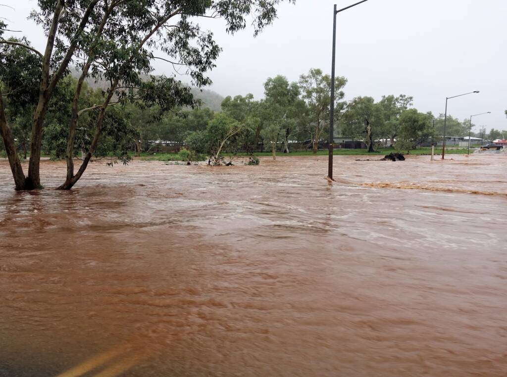 Todd River raging across Palm Circuit, Alice Springs, NT